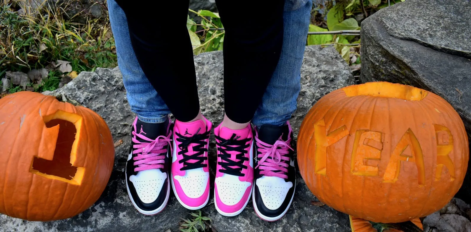 Anniversary photo showing matching Air Jordan sneakers with carved pumpkins