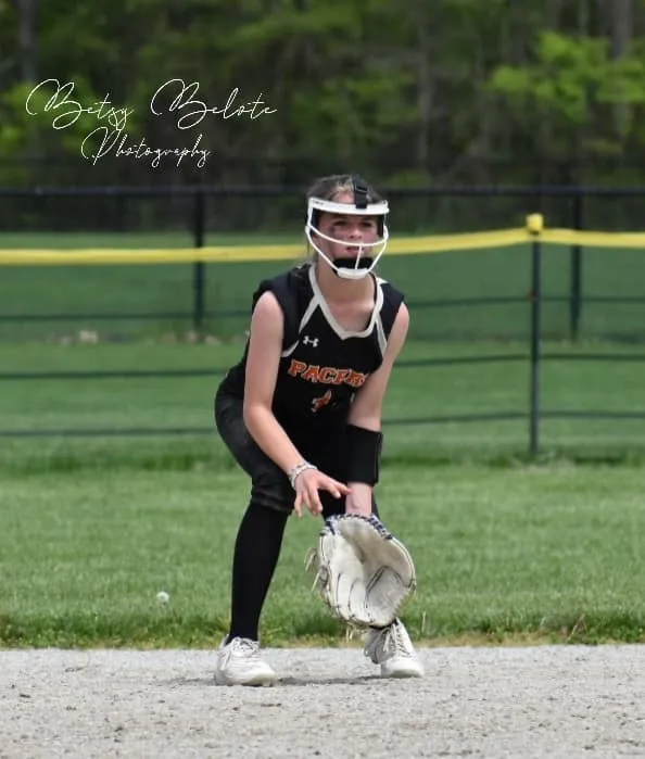 Young softball player in defensive ready stance